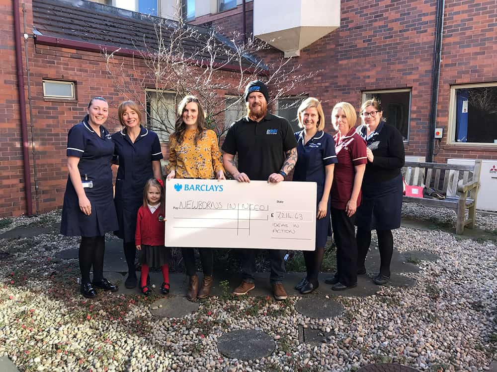 Ideas in Action presenting the cheque to the Neonatal Unit image