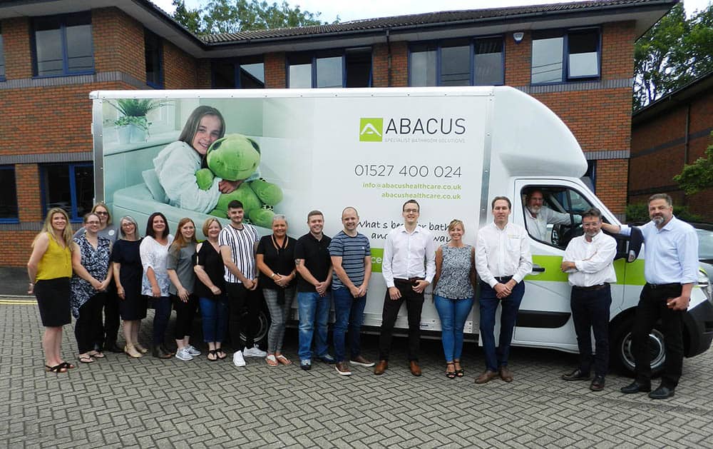 Members from the Gainsborough Healthcare Group celebrate the arrival of the new Abacus Specialist Bathroom Solutions Demonstration Vehicle.