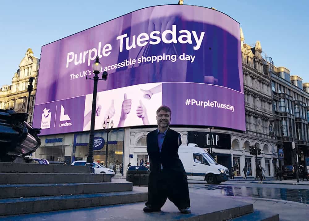 Mike Adams OBE at Picaddily Circus promoting Purple Tuesday