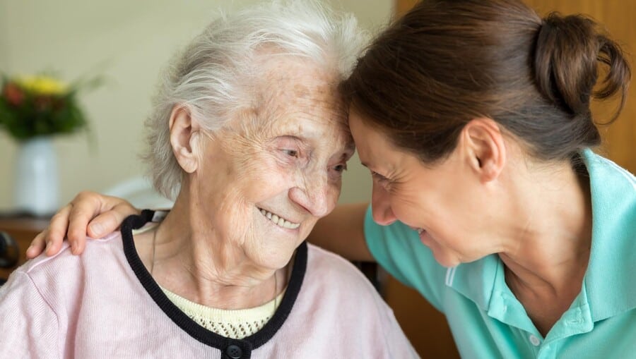 Older lady with carer, Credit Challenge Works